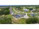 Lovely home featuring a screened pool and sprawling yard in a neighborhood with a picturesque lake and lush trees at 5429 County Road 125, Wildwood, FL 34785
