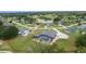 Desirable home with a screened pool and lush yard nestled in a community near a tranquil lake and abundant trees at 5429 County Road 125, Wildwood, FL 34785