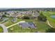 Gorgeous single-story property showcasing a screened pool, expansive yard, and prime location near the golf course at 5429 County Road 125, Wildwood, FL 34785