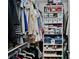 Organized walk-in closet featuring shelving and rods for ample clothing and storage solutions at 5429 County Road 125, Wildwood, FL 34785