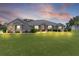 Charming home at dusk with a lush front lawn and manicured landscaping at 5429 County Road 125, Wildwood, FL 34785