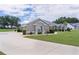 Charming home with a lush front lawn and manicured landscaping at 5429 County Road 125, Wildwood, FL 34785