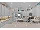 The bright kitchen has white cabinets, stainless steel appliances, and plenty of counter space at 5429 County Road 125, Wildwood, FL 34785