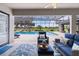 Spacious covered patio overlooking a screened pool and lush backyard at 5429 County Road 125, Wildwood, FL 34785
