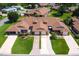 A captivating aerial view showcasing multiple homes and verdant landscaping at 5512 Rosewall Cir, Leesburg, FL 34748