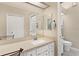 Bright bathroom features white vanity, ample counter space, and neutral finishes at 5512 Rosewall Cir, Leesburg, FL 34748