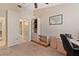 Bedroom featuring neutral carpet, ceiling fan, and light wood furniture at 5512 Rosewall Cir, Leesburg, FL 34748