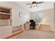 Bedroom featuring neutral carpet, ceiling fan, and light wood furniture at 5512 Rosewall Cir, Leesburg, FL 34748