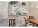 Charming breakfast bar overlooks an open kitchen with white cabinets and modern appliances at 5512 Rosewall Cir, Leesburg, FL 34748