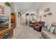 Expansive living room with a television, dining area, and open-concept layout leading to the kitchen at 5512 Rosewall Cir, Leesburg, FL 34748