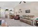 Open-concept living space featuring a dining area, comfortable seating, and an adjacent kitchen with a breakfast bar at 5512 Rosewall Cir, Leesburg, FL 34748