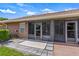 Outdoor patio featuring a tiled floor and glass windows, perfect for relaxation at 5512 Rosewall Cir, Leesburg, FL 34748