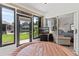 Bright sunroom with a hot tub and views of the outdoor garden and green lawn at 5512 Rosewall Cir, Leesburg, FL 34748