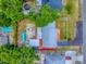 An aerial view of a house and its backyard featuring a greenhouse and a hot tub at 564 Lancaster Ave, Orange City, FL 32763