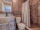 Elegant bathroom showcasing tile walls, decorative accents, and modern fixtures at 564 Lancaster Ave, Orange City, FL 32763