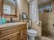 Bathroom featuring vanity with granite countertop and a tiled shower at 564 Lancaster Ave, Orange City, FL 32763