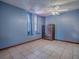 Bedroom with neutral tones, tile floor, and a wooden dresser at 564 Lancaster Ave, Orange City, FL 32763