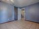 Bedroom featuring neutral walls, tile flooring, and natural light at 564 Lancaster Ave, Orange City, FL 32763