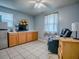 Bedroom featuring built-in cabinets, bar fridge, and tile floors at 564 Lancaster Ave, Orange City, FL 32763