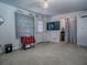 Bright bedroom with modern lighting, and ample room for decor, creating a welcoming space at 564 Lancaster Ave, Orange City, FL 32763