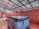 Relaxing hot tub area with covered patio, ideal for outdoor leisure and entertainment at 564 Lancaster Ave, Orange City, FL 32763