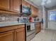 Well-equipped kitchen featuring stainless steel appliances and plenty of cabinet space at 564 Lancaster Ave, Orange City, FL 32763
