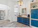 Cozy living area featuring a blue accent cabinet with views into the foyer and living spaces at 5746 Botner Dr, The Villages, FL 32163