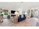 Cozy living room featuring fireplace with white shiplap and comfortable seating at 5746 Botner Dr, The Villages, FL 32163