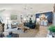 An open concept living room and dining room at 5746 Botner Dr, The Villages, FL 32163