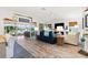 Bright living room with sliding glass doors offering views of the lake and backyard at 5746 Botner Dr, The Villages, FL 32163