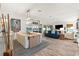 Spacious living room with a view of a lake and coastal decor at 5746 Botner Dr, The Villages, FL 32163