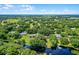 Overhead image of the property near the lake, with plenty of mature trees and nearby docks at 5825 Lake Emma Ct, Groveland, FL 34736