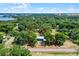 Aerial view of lot boundary with a blue shed, mature trees, and a road that highlights the property lines at 5825 Lake Emma Ct, Groveland, FL 34736