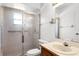 Bathroom featuring frosted glass shower, toilet, vanity and sink at 5825 Lake Emma Ct, Groveland, FL 34736