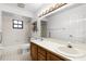 Well-lit bathroom featuring double sinks, a shower-tub combination, and modern fixtures at 5825 Lake Emma Ct, Groveland, FL 34736