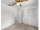 Bedroom with closet space and ceiling fan provides comfort and convenience at 5825 Lake Emma Ct, Groveland, FL 34736