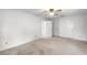 Bright bedroom with three closets and ceiling fan providing ample storage and comfort at 5825 Lake Emma Ct, Groveland, FL 34736