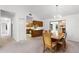 Open-concept living space featuring the dining room, kitchen, and a fireplace at 5825 Lake Emma Ct, Groveland, FL 34736