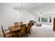 Open-concept living space with views of the dining room, living room, and a fireplace at 5825 Lake Emma Ct, Groveland, FL 34736