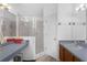 Bright bathroom with an enclosed shower, well-lit vanity, and clean and well-maintained tile at 6556 Piccadilly Ln, Orlando, FL 32835