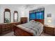 Bedroom with natural light, wooden dressers, and a full sized bed at 6556 Piccadilly Ln, Orlando, FL 32835