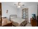 Bedroom featuring a ceiling fan, medium toned furniture, and bright natural light at 6556 Piccadilly Ln, Orlando, FL 32835