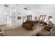 Spacious living room featuring vaulted ceilings, a ceiling fan, and an adjacent dining area at 6556 Piccadilly Ln, Orlando, FL 32835