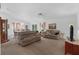 Bright living room with vaulted ceilings, ceiling fan, and sliding glass doors that let in lots of light at 6556 Piccadilly Ln, Orlando, FL 32835