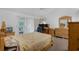 Tranquil main bedroom with natural light, a ceiling fan, and access to a private outdoor patio at 6556 Piccadilly Ln, Orlando, FL 32835