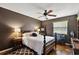 Comfortable bedroom with a ceiling fan, a window for natural light, and stylish decor at 672 E Belt Ave, Bushnell, FL 33513