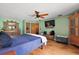 Bright bedroom with hardwood floors, ceiling fan, natural light, and neutral-colored walls at 672 E Belt Ave, Bushnell, FL 33513