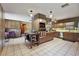 Spacious kitchen featuring an island, stainless steel appliances, ample counter space, and tile floors at 672 E Belt Ave, Bushnell, FL 33513