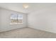This bedroom has neutral colored carpet and a bright window at 752 Sandy Bar Dr, Winter Garden, FL 34787