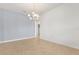 Spacious dining area with light blue accent wall and a modern chandelier, perfect for entertaining at 752 Sandy Bar Dr, Winter Garden, FL 34787